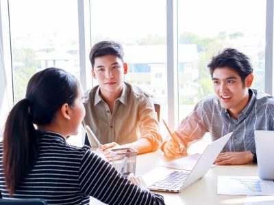 group of young businessmen are meeting brainstorming and planning modern office work. Team work concept